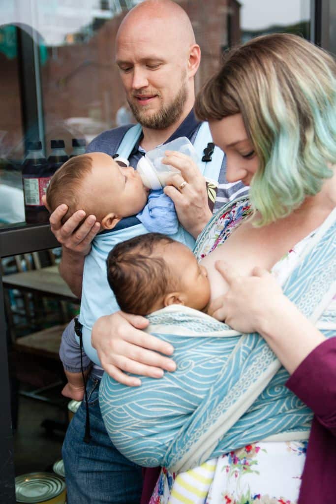 bottle feeding in baby carrier
